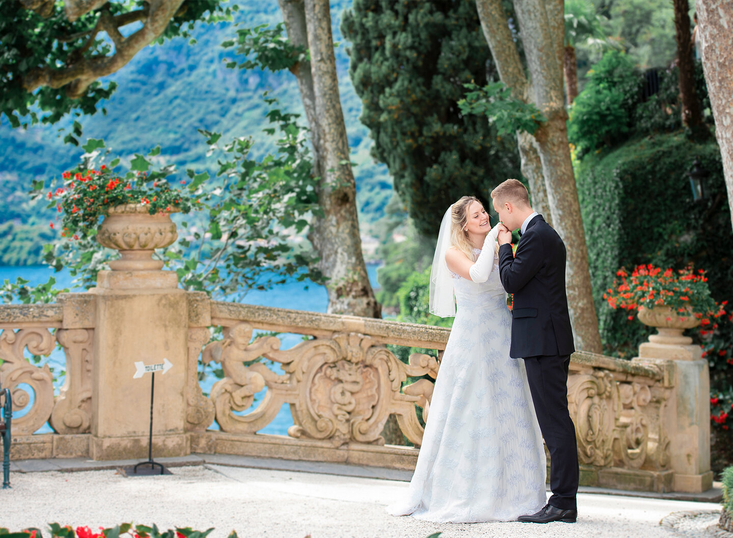 Lake Como elopement: bride and groom on Villa del Balbianello terrace