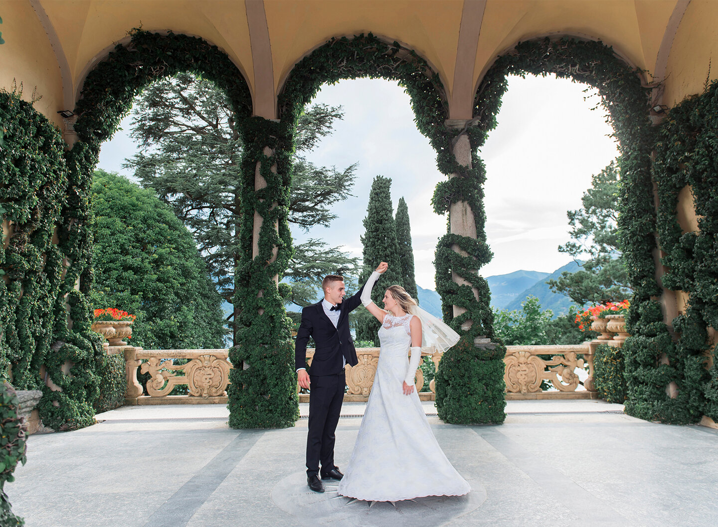 Bride and groom dancing on the villa's porch