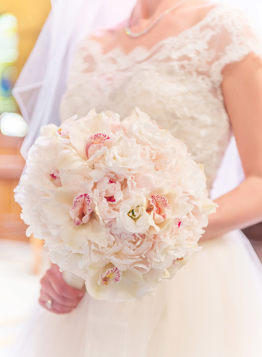 A detail of the bride and her bouquet