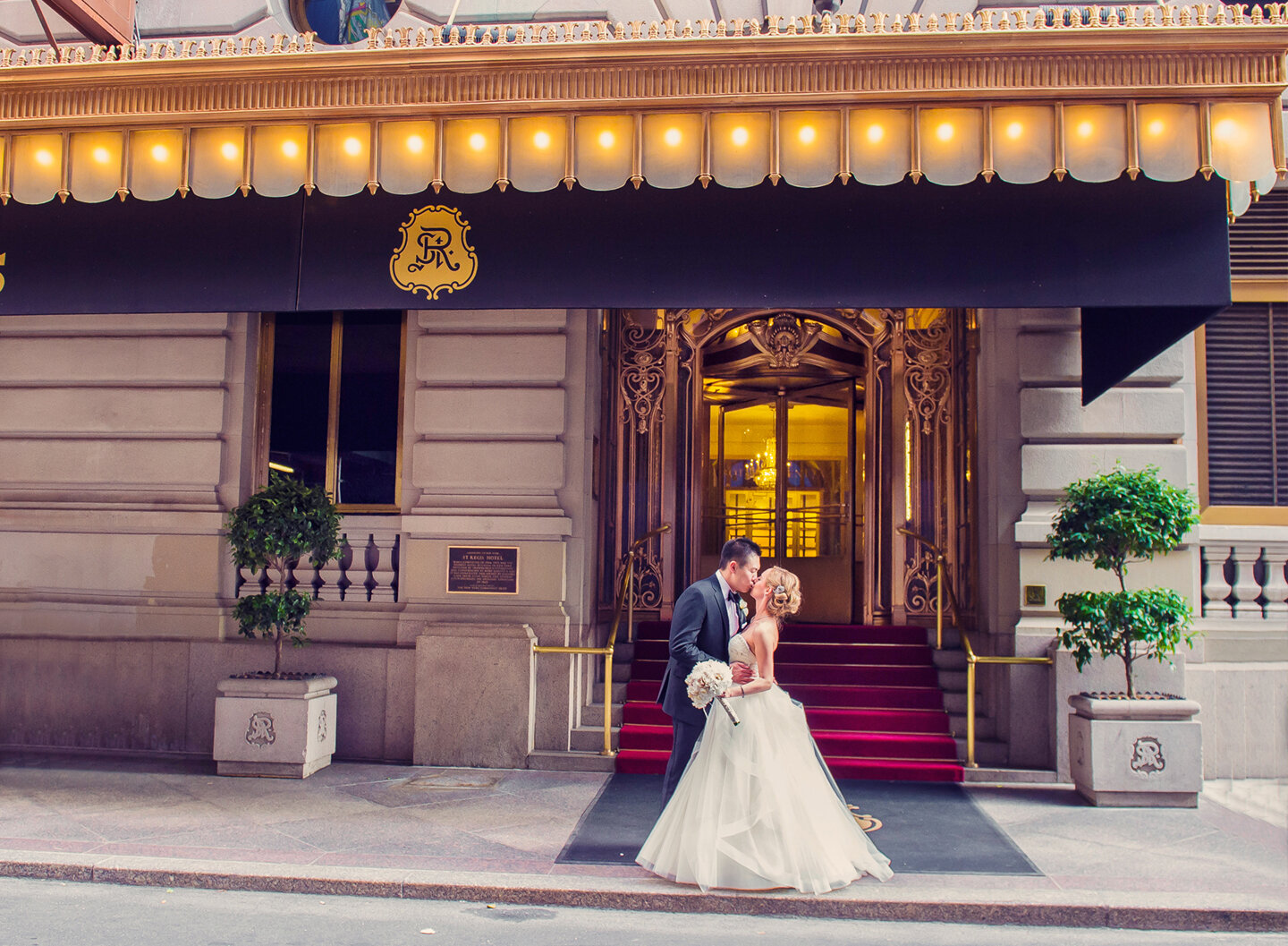 The bride and the groom outside St. Regis Hotel