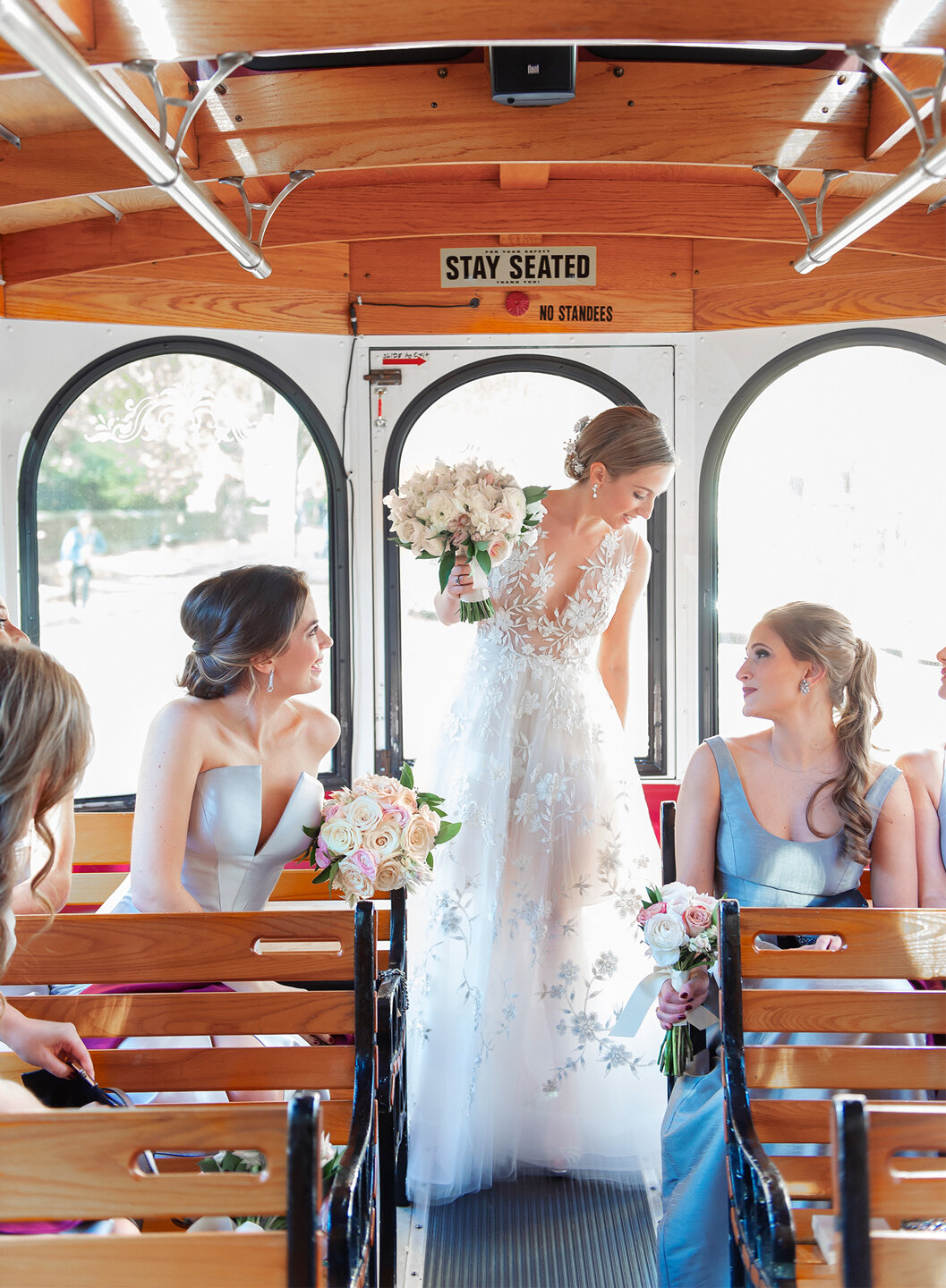 Bride riding in trolley car