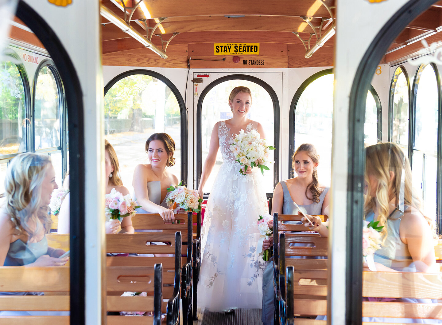 Trolley car with bride and bridesmaids